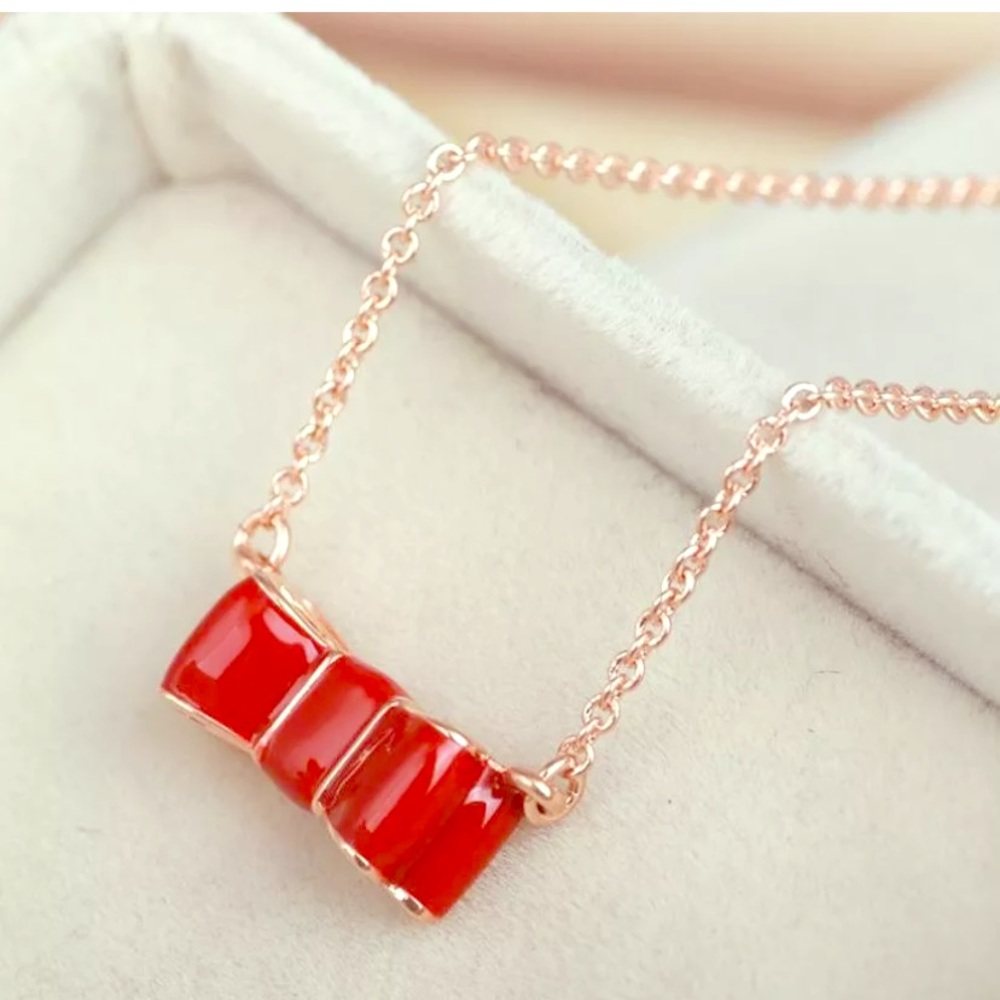 NWT Kate♠️Rose Gold Enamel Red Take A Bow Necklace - Picture 1 of 4